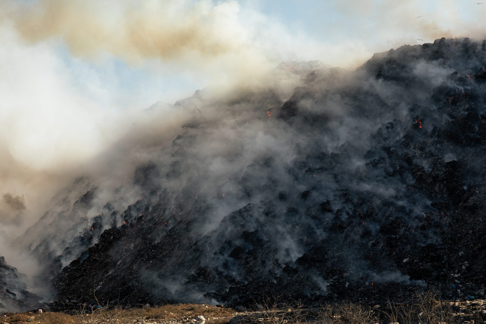 An image showing the burning of the landfills. 