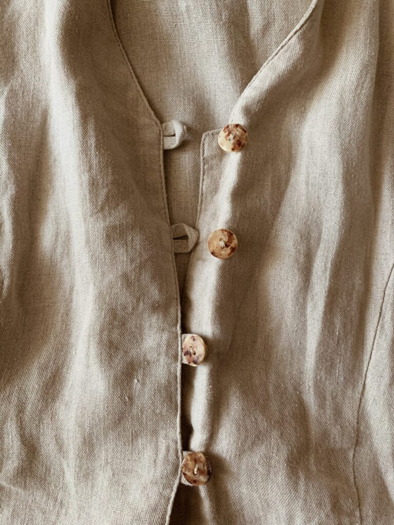 An image of a shirt with buttons.